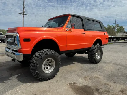 Lifted orange Chevy K5 Blazer build by Midwest Custom Trucks