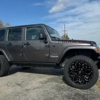 Black Jeep Wrangler Rubicon on custom black wheels