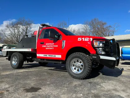Custom flatbed truck build with grille guard and front bumper