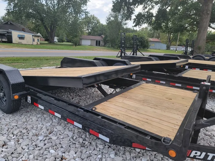 Open 20-foot car hauler trailer with wood deck