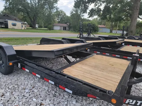 Open 20-foot car hauler trailer with wood deck