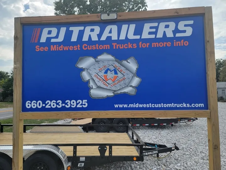 Heavy-duty equipment trailer with dovetail and ramps