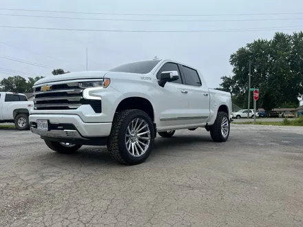 Chevy Silverado on polished chrome wheels and all-terrain tires