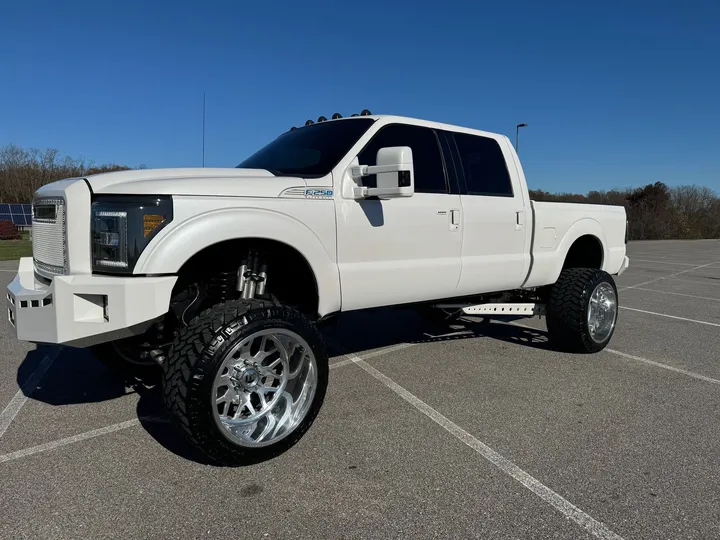 Truck with custom forged wheels and off-road tires